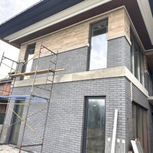 Eye-catching mix of brick-look and large-format facade tiles