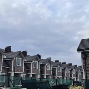 Energy-efficient building exterior finished with durable thermopanels