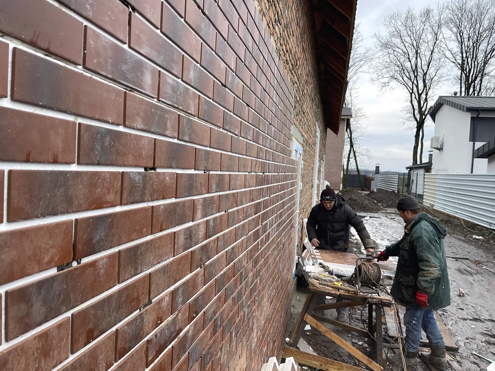 Modern red-and-white facade design of Cherry Hills apartments