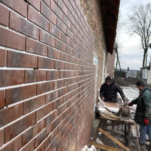 Modern red-and-white facade design of Cherry Hills apartments